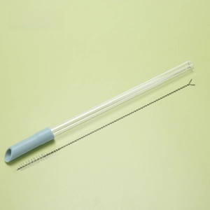 Macro detail of reusable TRITAN telescopic straw in light blue with cleaning brush tool