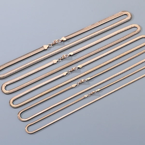 Flat rose gold snake bone necklaces in six different widths with smooth metal finish