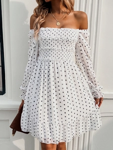 Chic off-the-shoulder white polka dot dress with ruffled long sleeves and pleated details