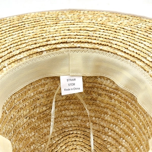 French retro wheat straw sun hat featuring a 13cm wide brim and 57cm inner label detail