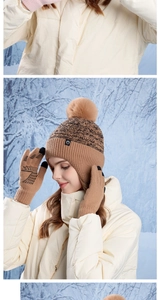 Detail of warm winter knit beanie with pompom and touch screen gloves in camel color