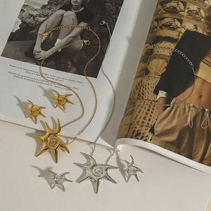 Detailed set of gold and silver starfish pendant necklaces and matching stud earrings