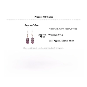 Detail showing vintage purple resin drop earrings with small elephant metal charms