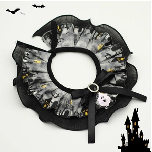 Detail of Halloween pet lace collar with black bow, ghost charm, and spooky prints