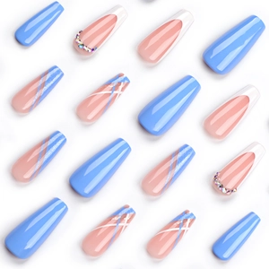 Long blue coffin press-on nails with french white tips, rhinestones, and glitter patterns
