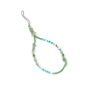 Detail of handmade beaded phone strap with green stones, striped beads, and gold spacers