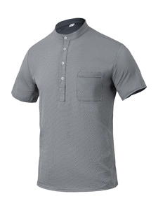 Detail of grey short sleeve waffle knit Henley shirt with chest pocket and texture