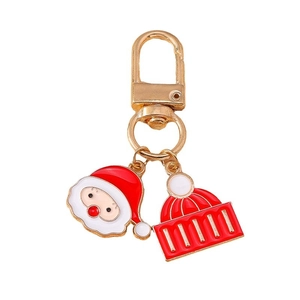 Cartoon Santa Claus keychain with red striped hat pendant in gold finish metal