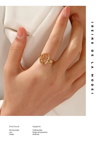 Detailed view of an 18K gold plated hollow portrait ring worn on a finger