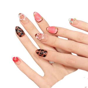 Pink and brown handmade press-on nails with leopard print and 3D floral accents