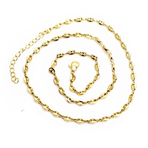 Detailed close-up of golden coffee bean link chain with lobster clasp and extension