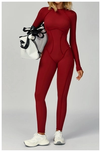 Burgundy long sleeve yoga bodysuit with contoured seam lines and slim fit design