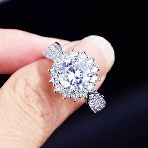 Exquisite sunflower ring in silver finish with micro-pave zircon on hand with black background