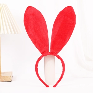 Detail of red plush rabbit ear headband with soft furry texture on a clean white background
