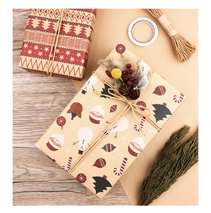 Detail of vintage kraft Christmas wrapping paper with festive reindeer and Santa patterns
