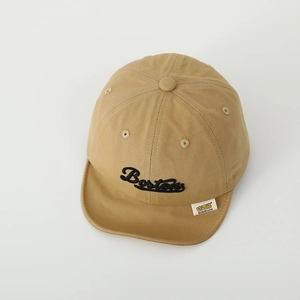 Detail of khaki cotton baby cap featuring Boston embroidery and breathable vents
