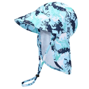 Detail of baby sun hat with neck flap and cute cartoon dinosaur prints in light blue