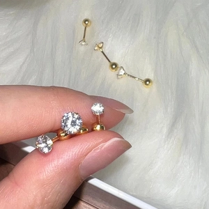 Golden 925 sterling silver stud earrings with sparkling clear round cubic zirconia
