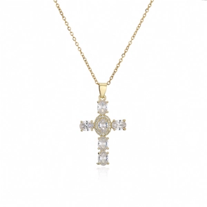Macro detail of gold cross pendant featuring sparkling oval zircons and micro-pave setting