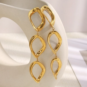 Detail of 18K gold plated stainless steel earrings with triple irregular hollow rings