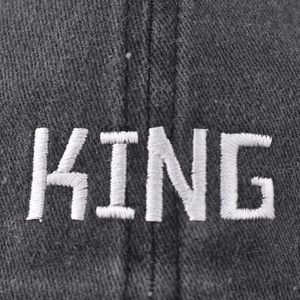 Washed dark grey baseball cap featuring white 3D KING embroidery and twill texture