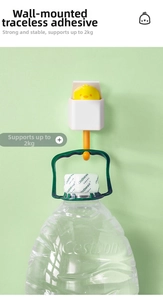 Cartoon wall hook holding a heavy water bottle to demonstrate 2kg strong load capacity