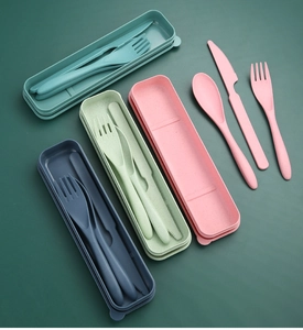 Detail view of four-color wheat straw cutlery sets with case in green, pink and blue