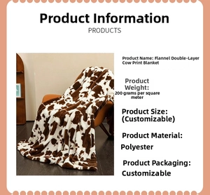 Close-up of flannel cow print blanket showing 200g/㎡ soft polyester texture details