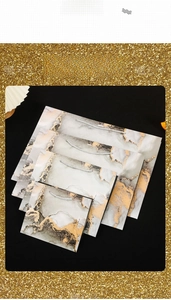 Modern marble pattern gift bags in four sizes with silver handles and gold foil accents