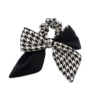 Plaid and black flocked fabric bow scrunchie for an elegant low ponytail look