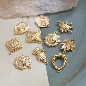 Gold plated vintage sun maple leaf rose pendants DIY jewelry accessory set on paper