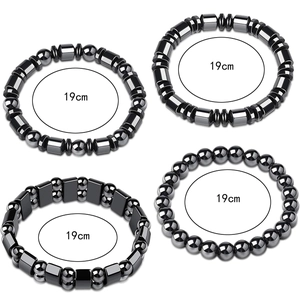 Detail view of four 19cm elastic bracelets with dark grey metallic hematite beads