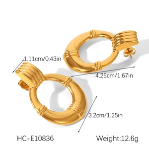 Detailed size measurement of golden round hoop earrings showing 4.25cm length and weight