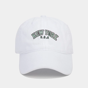 Close-up of the vintage white cotton baseball cap featuring green New York embroidery