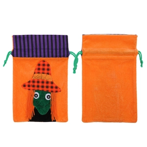 Orange velvet Halloween drawstring gift bags with witch character and purple striped accents