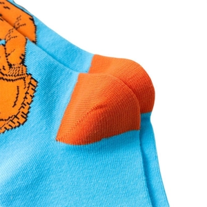 Detailed close-up of light blue knitted cotton sock with orange reinforced heel stitch