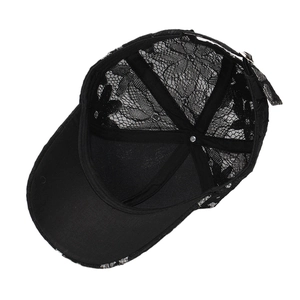 Women's black floral lace baseball cap showing internal structure and adjustable strap