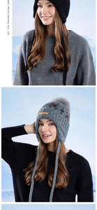 Detailed knit texture and warm ear flaps on a winter trapper hat for women in outdoors