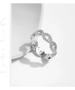 Close-up of eternity band ring with white stones and twisted silver rope design