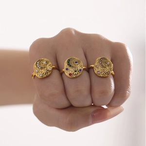Three-piece gold ring set featuring moon star and evil eye motifs with 5A zircon stones