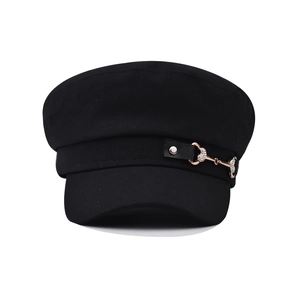 Black baker boy hat featuring a decorative leather strap and golden heart rhinestone buckle