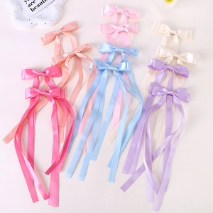 Double-layered satin bow hair clips with long ribbons in assorted pastel colors