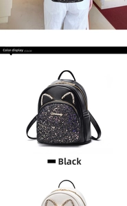 Detail of black leather cat ear backpack with purple glitter and shiny crystal accents