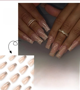 Detailed long square press-on nails with nude base and gold glitter French tips