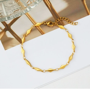Detailed view of the gold-plated geometric rhombus link chain necklace with lobster clasp