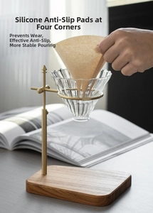 Detail of adjustable brass coffee dripper stand with solid wood base and anti-slip pads