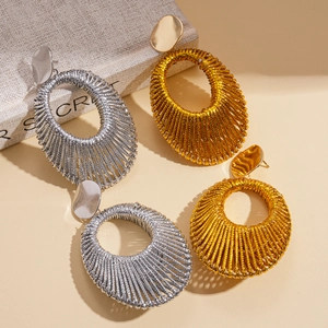 Velvet woven hollow oval earrings in gold and silver finish with metallic texture