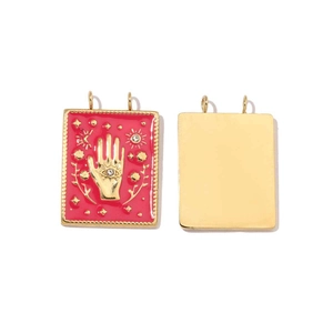 Macro detail of gold-plated rectangular Hamsa Hand and Evil Eye enamel pendant charm