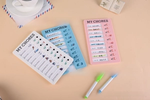 Detail of sliding task markers on white, pink and blue daily schedule memo boards