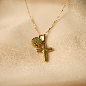 Gold stainless steel cross necklace with a round Fu character lucky pendant on silk